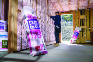 Pink fiberglass insulation installed in a home.